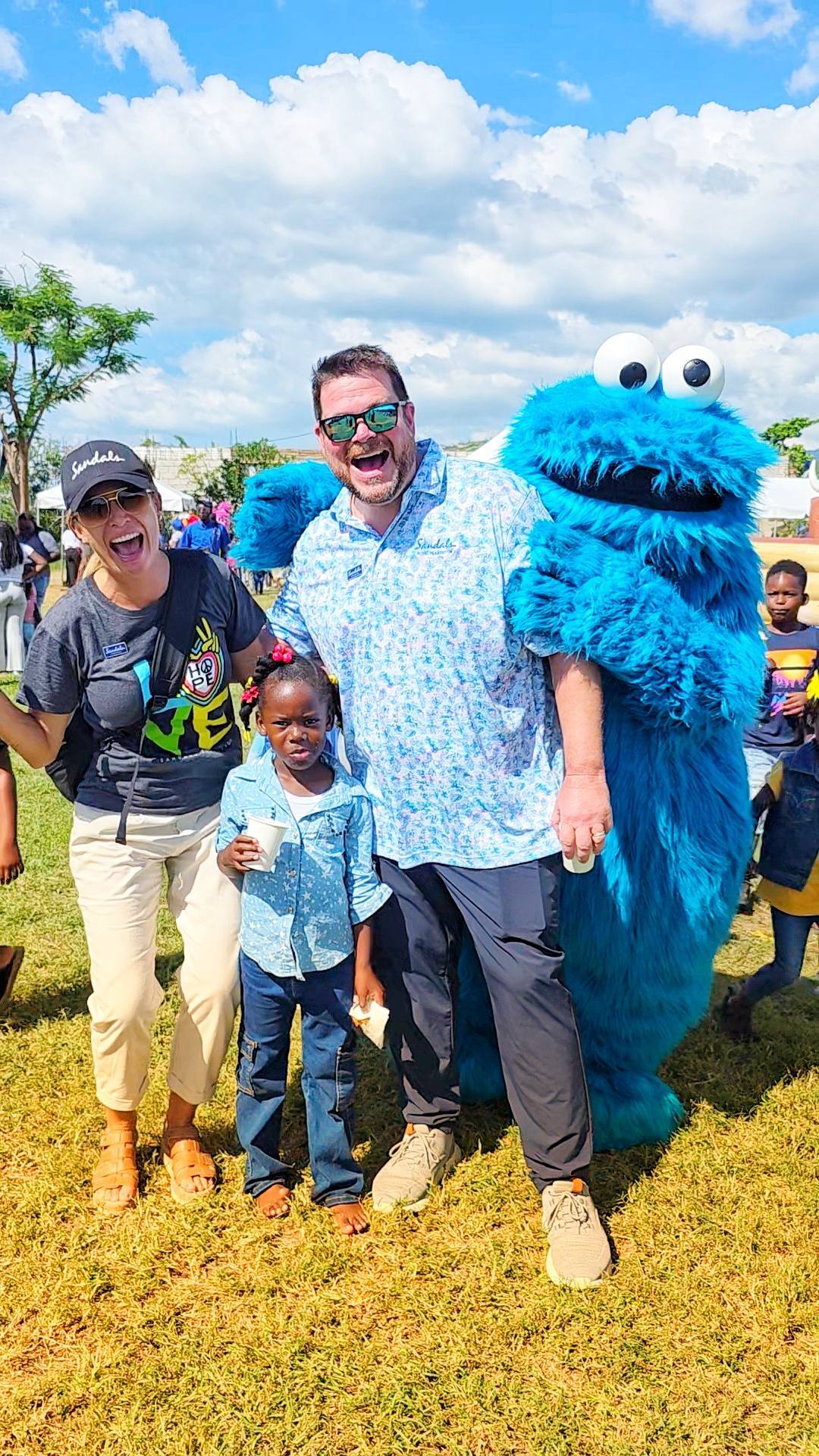 Clint Finch the sand lady with sandals foundation christmas party jamaica